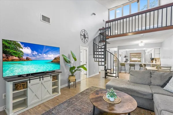 a living room with furniture and a rug