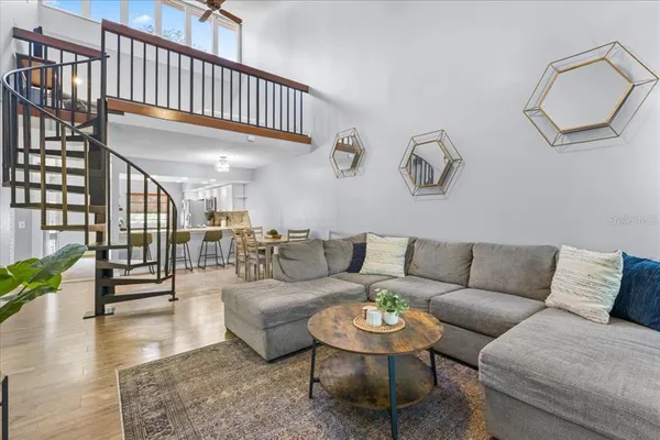 a living room with furniture and a rug