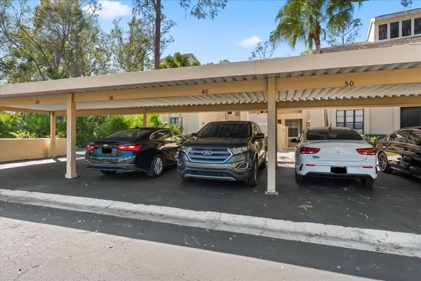 a car parked in parking lot of a building