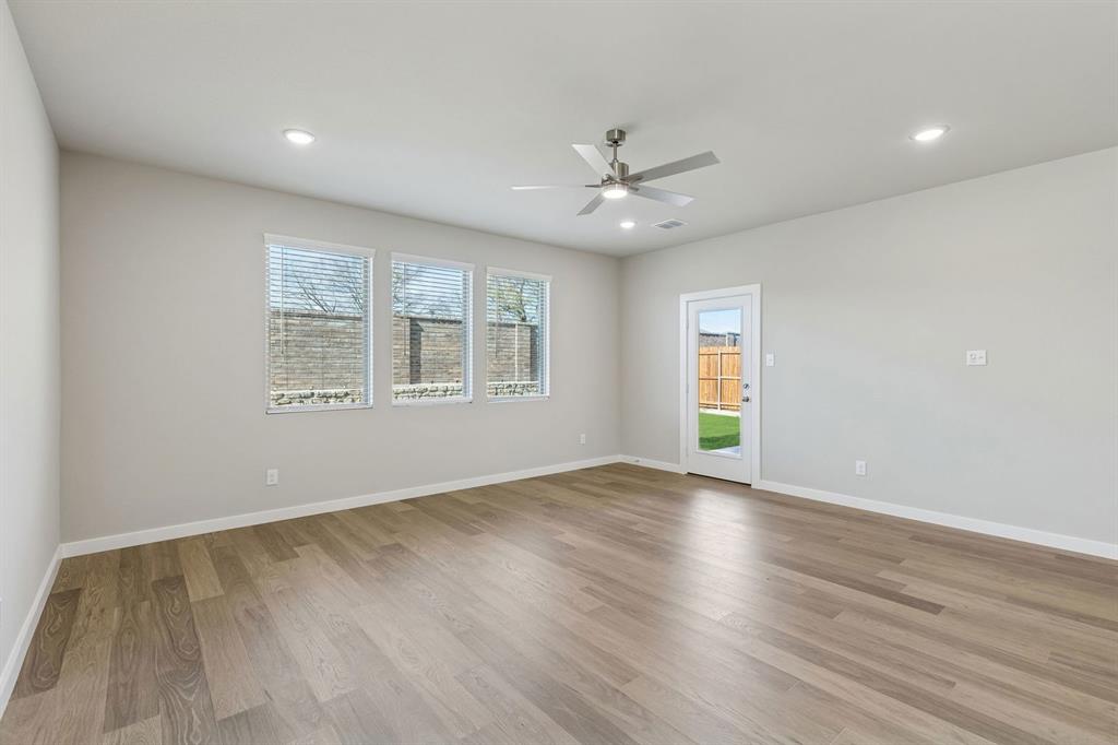 1148 Del Rio Drive Lavon, TX 75166 - Photo 15 of 35 Living Room in the Holden home plan by Trophy Signature Homes – REPRESENTATIVE PHOTO
