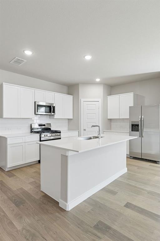 1148 Del Rio Drive Lavon, TX 75166 - Photo 9 of 35 Kitchen in the Holden home plan by Trophy Signature Homes – REPRESENTATIVE PHOTO