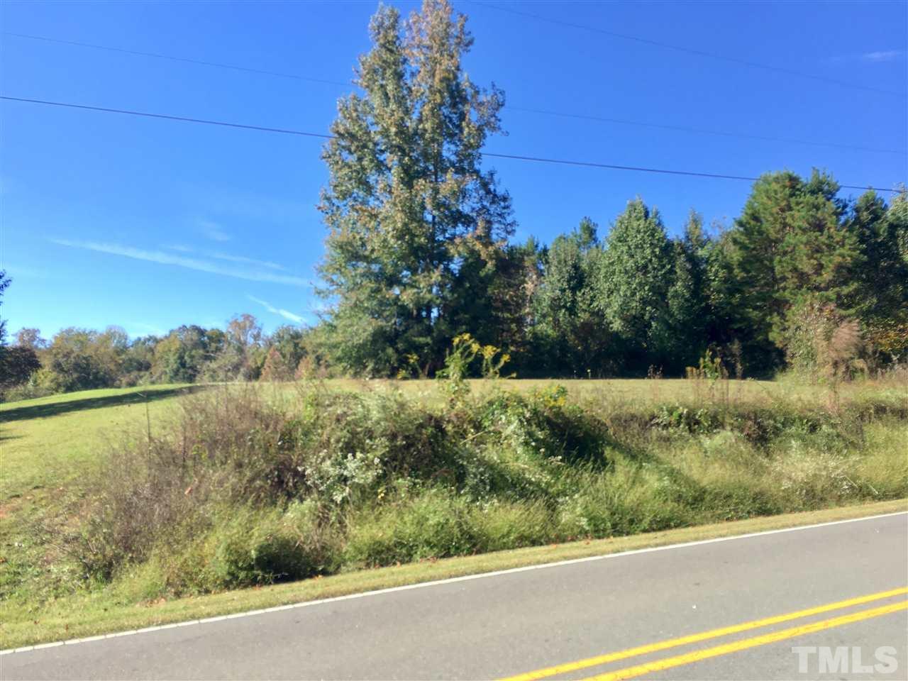 15.93-acre Country Club Road Roxboro, NC 27574 - Photo 1 of 4 a view of a yard with a lake view