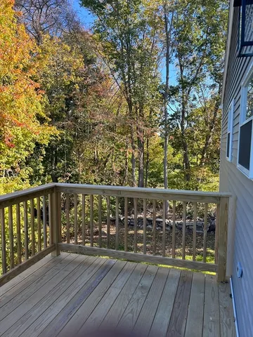 a view of deck with a flat tv screen and a wooden floor
