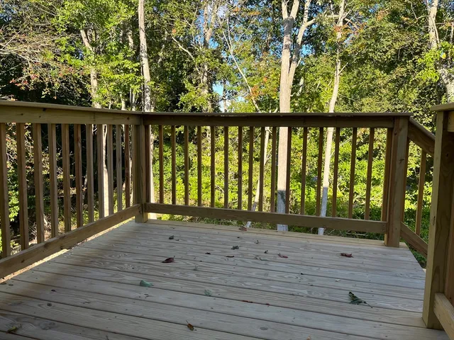 a view of deck with a flat tv screen and a wooden floor