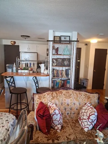 a bedroom with furniture and a book shelf