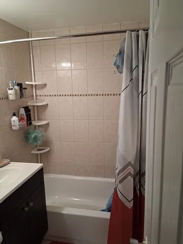 a bathroom with a bathtub a sink and toilet