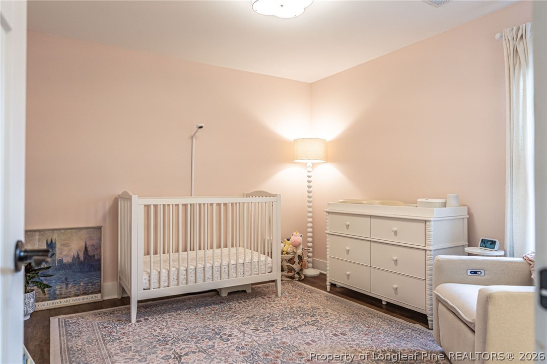 480 Clark Street Southern Pines, NC 28387 - Photo 17 of 28 a bedroom with a bed and a window