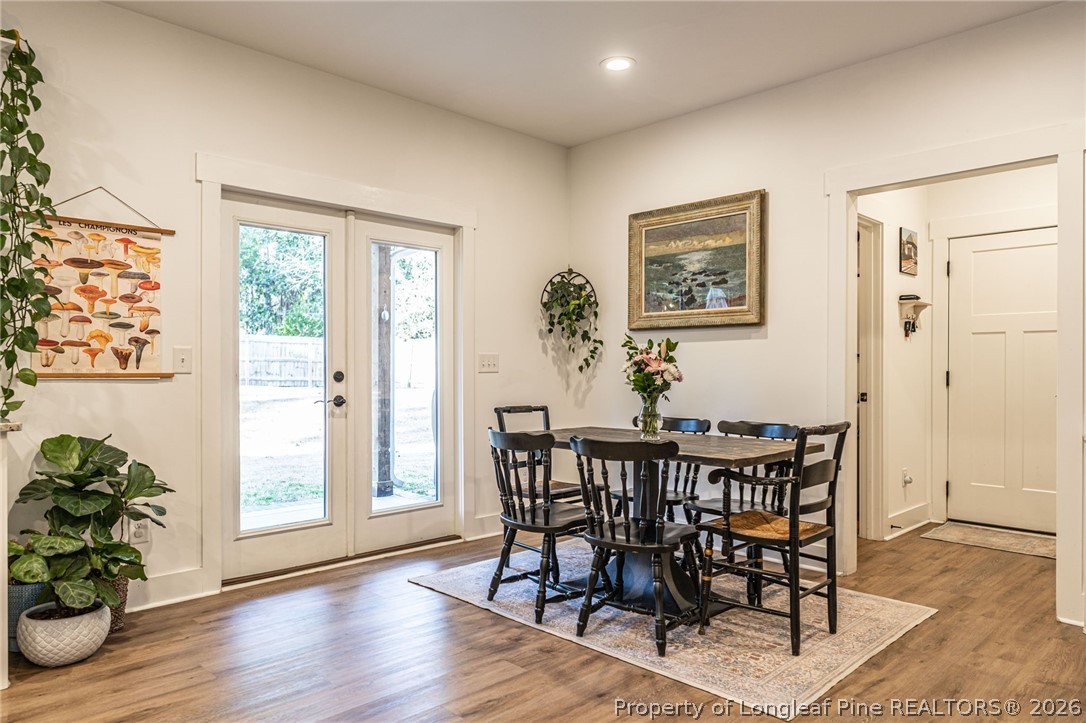 480 Clark Street Southern Pines, NC 28387 - Photo 10 of 28 a view of a dining room with furniture window and wooden floor