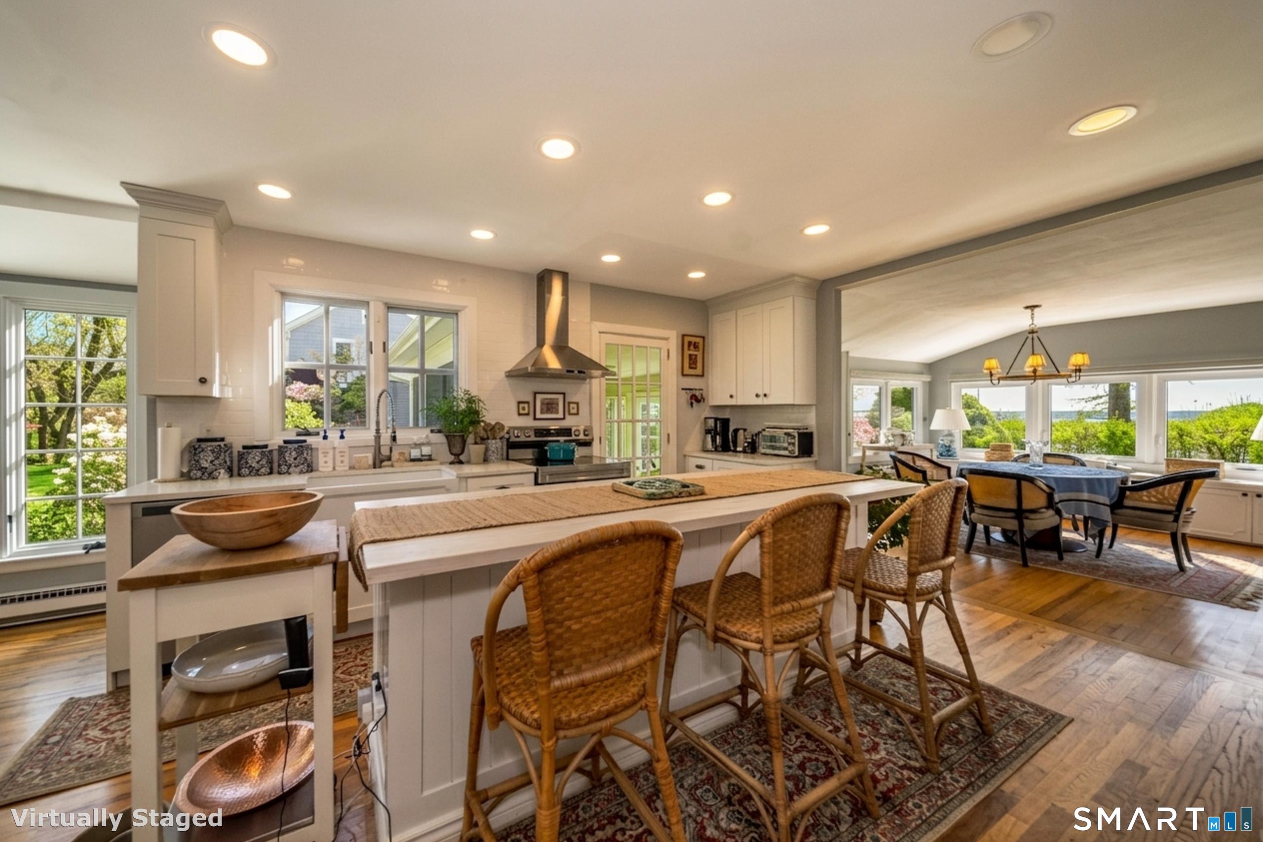 121 Middle Beach Road Madison, CT 06443 - Photo 6 of 21 a kitchen with a table and chairs