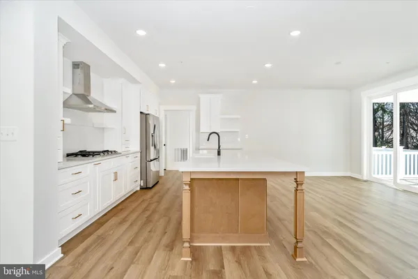 a view of kitchen with furniture and wooden floor