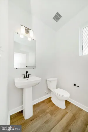 a bathroom with a sink a mirror and a shower