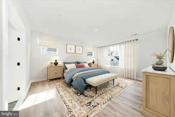 a view of a room with wooden floor