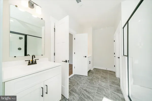 a bathroom with a sink a toilet and a bathtub