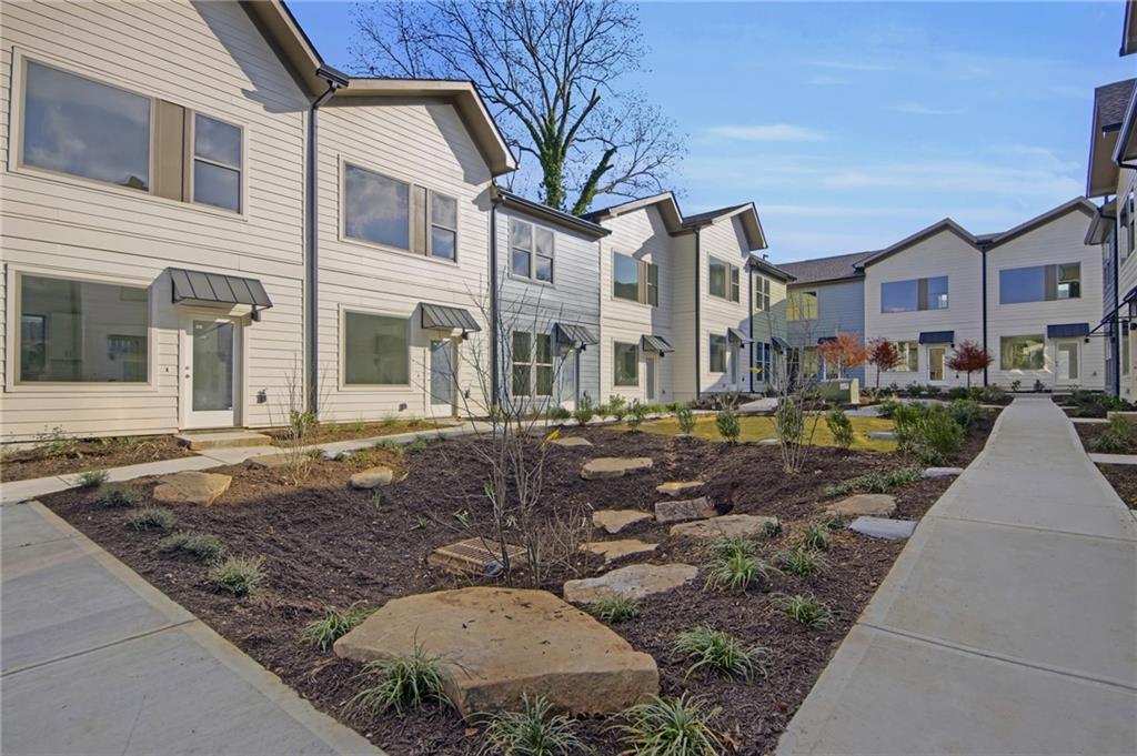 1070 Dill Avenue Southwest, Unit 306 Atlanta, GA 30310 - Photo 13 of 17 a view of a street with brick building in front of it