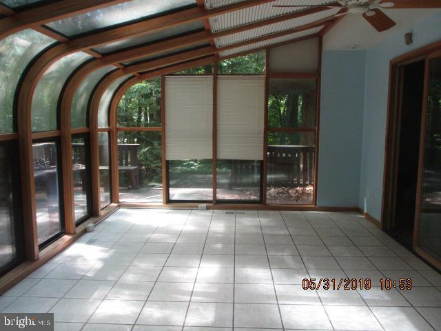 31 Springhill Road Mantua, NJ 08051 - Photo 14 of 16 a view of a fireplace and window in the room