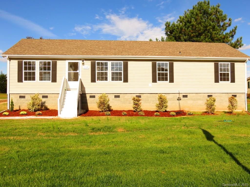 1028 Tot Dellinger Road Cherryville, NC 28021 - Photo 1 of 21 a front view of a house with a yard