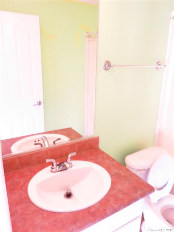 1028 Tot Dellinger Road Cherryville, NC 28021 - Photo 17 of 21 a bathroom with a sink and a mirror