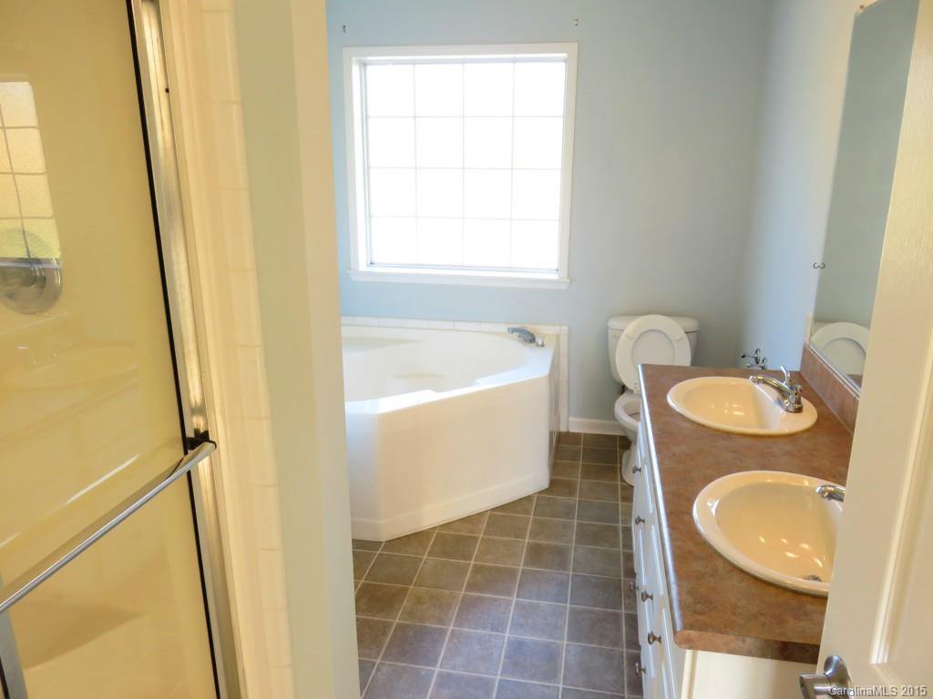 1028 Tot Dellinger Road Cherryville, NC 28021 - Photo 21 of 21 a bathroom with a granite countertop sink toilet and shower
