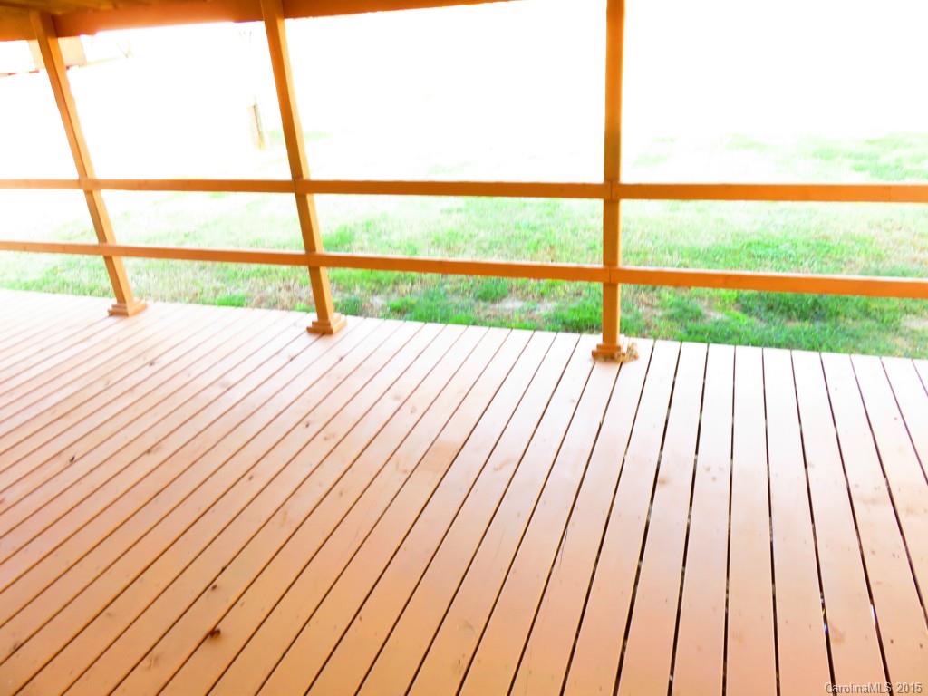 1028 Tot Dellinger Road Cherryville, NC 28021 - Photo 6 of 21 a view of wooden floor with a floor to ceiling window