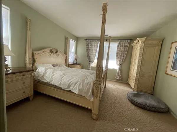 a bathroom with a double vanity sink mirror and shower