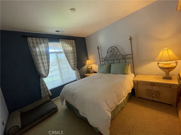 a bathroom with a sink a tub and a mirror