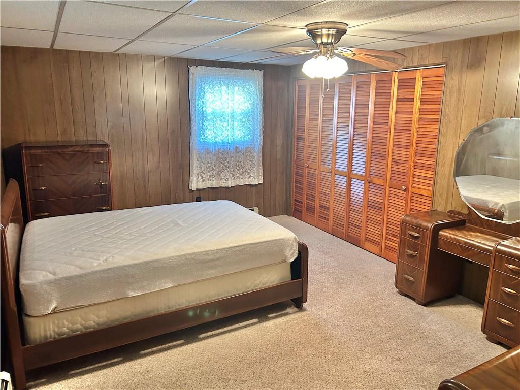 562 Smith Run Road Amity, PA 15311 - Photo 14 of 26 a bedroom with a bed dresser and a chandelier