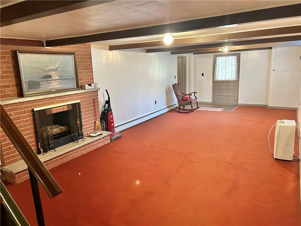 562 Smith Run Road Amity, PA 15311 - Photo 23 of 26 a view of empty room with fireplace and wooden floor