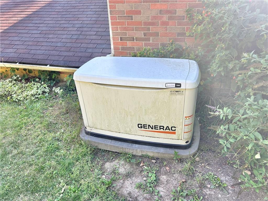 562 Smith Run Road Amity, PA 15311 - Photo 25 of 26 a view of a back yard with a brick wall