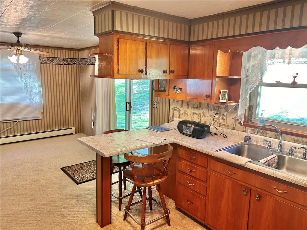 562 Smith Run Road Amity, PA 15311 - Photo 10 of 26 a kitchen with a sink a stove and a refrigerator
