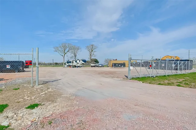 a view of a town with big trees