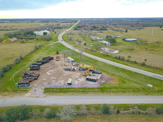 an aerial view of beach and residential houses with outdoor space