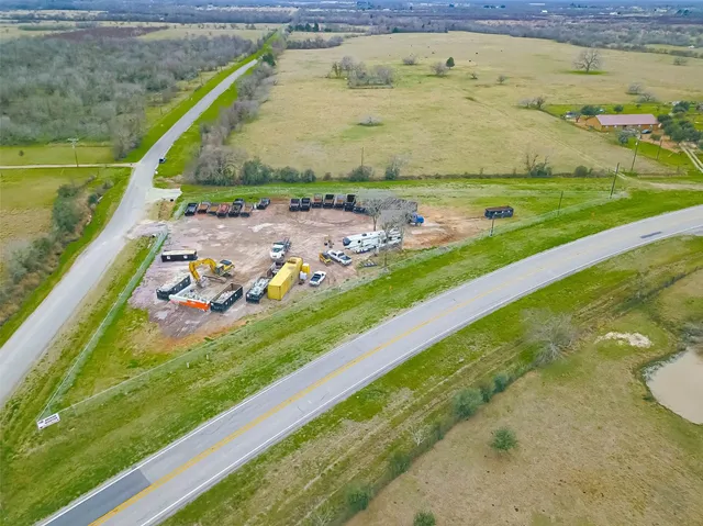an aerial view of a residential houses with outdoor space