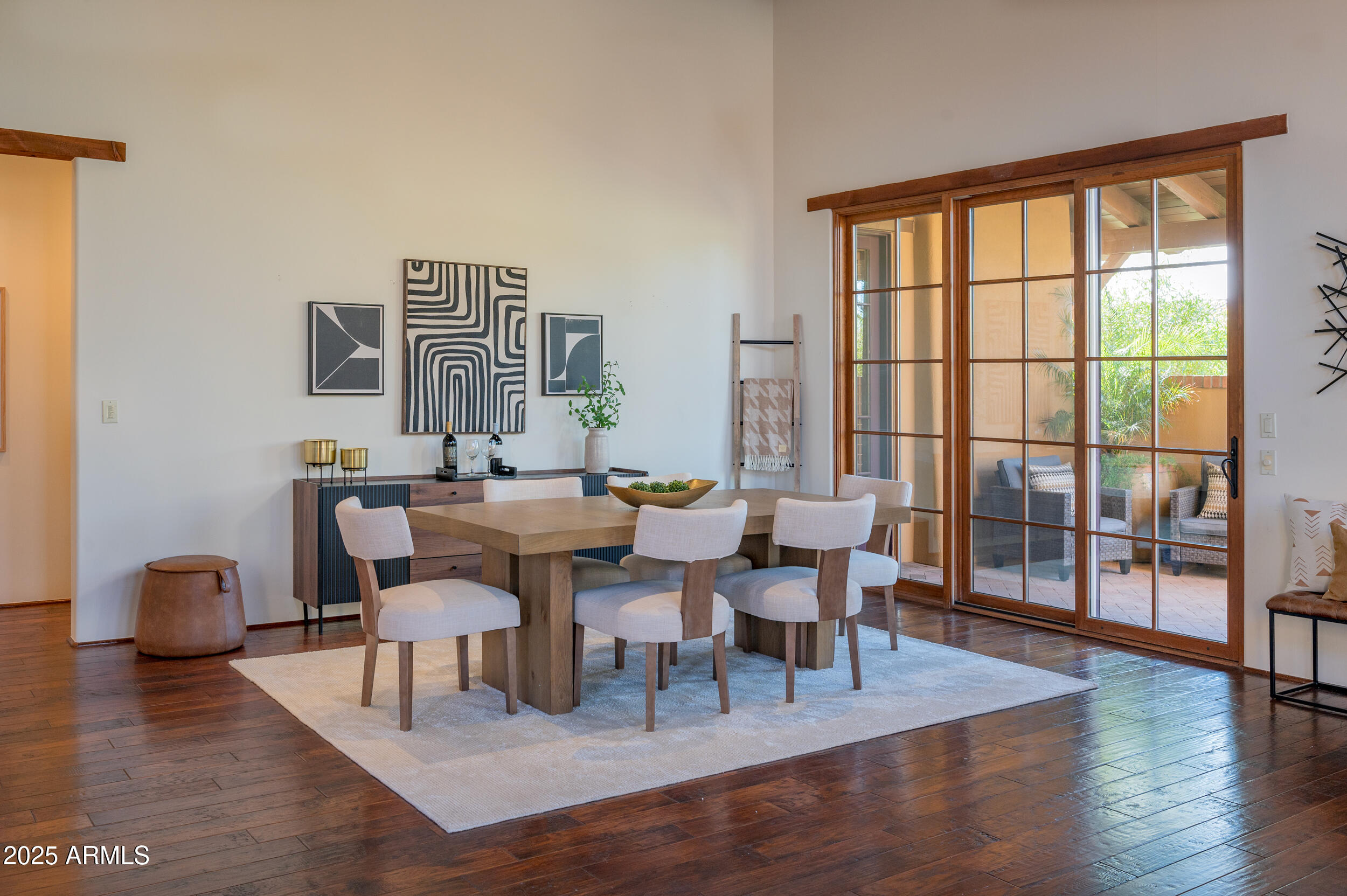 10575 East Rising Sun Drive Scottsdale, AZ 85262 - Photo 12 of 48 a view of a dining room with furniture and wooden floor