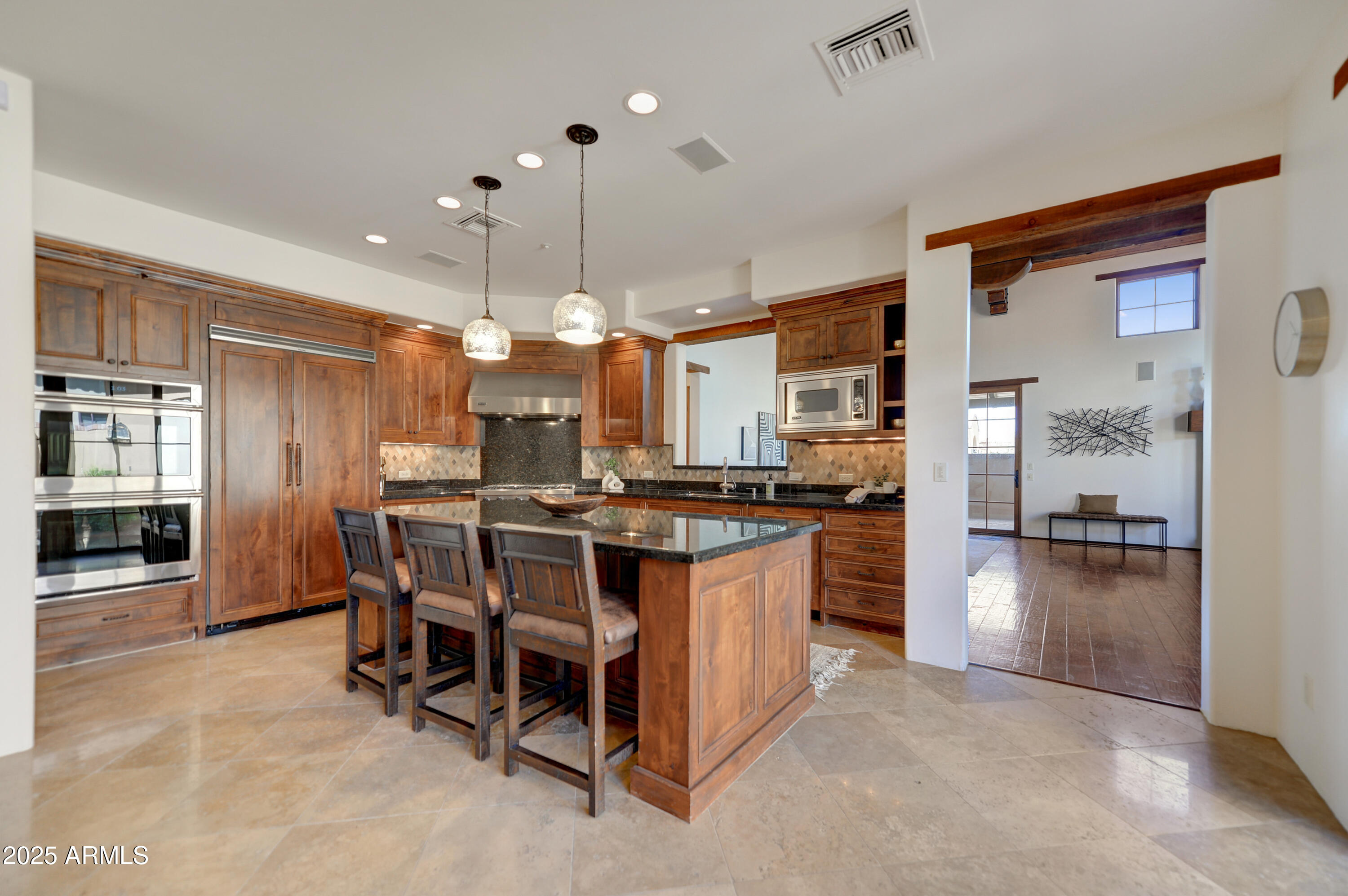 10575 East Rising Sun Drive Scottsdale, AZ 85262 - Photo 14 of 48 a kitchen with a table and chairs in it