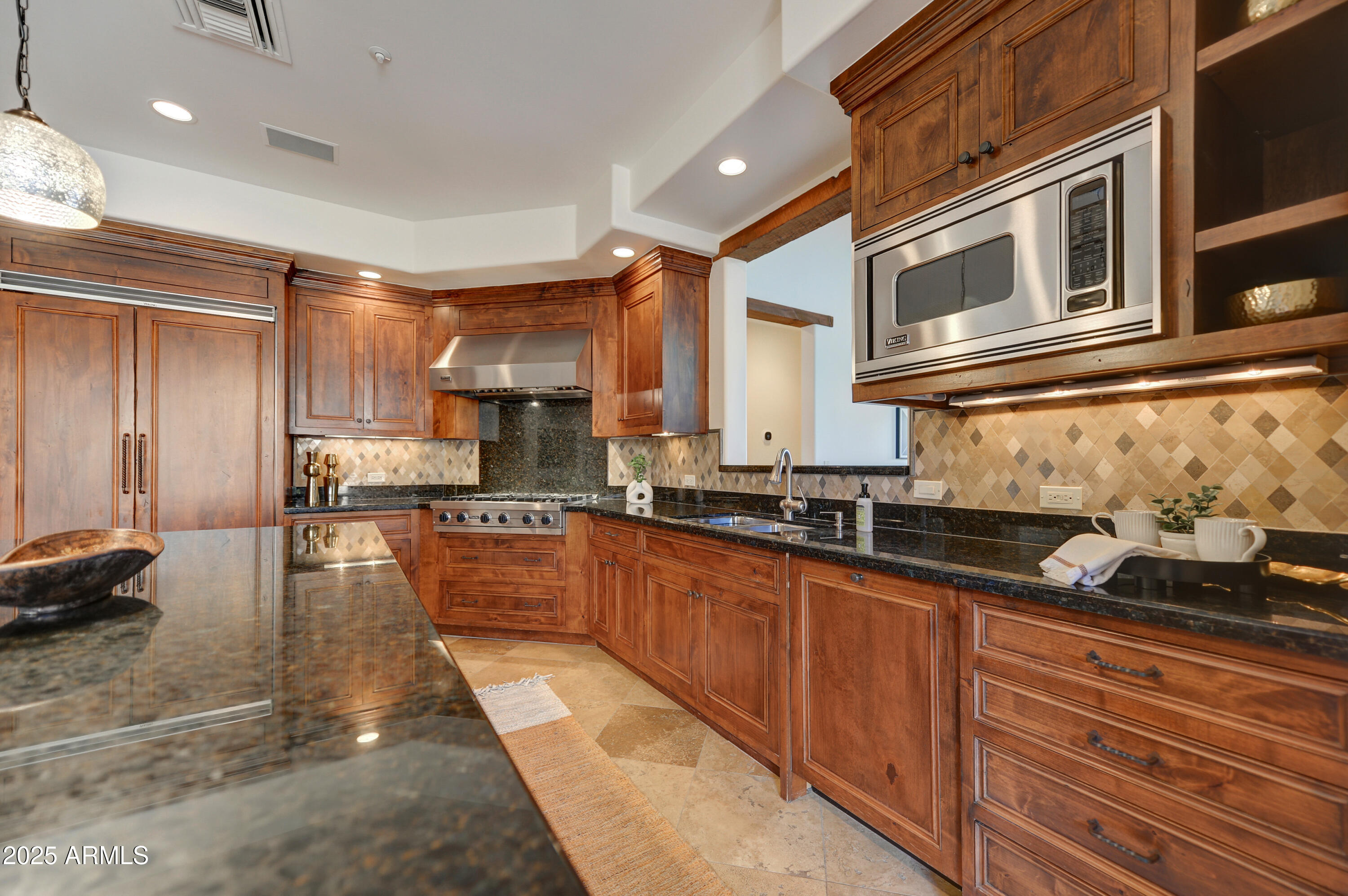 10575 East Rising Sun Drive Scottsdale, AZ 85262 - Photo 16 of 48 a kitchen with granite countertop lots of counter top space and appliances