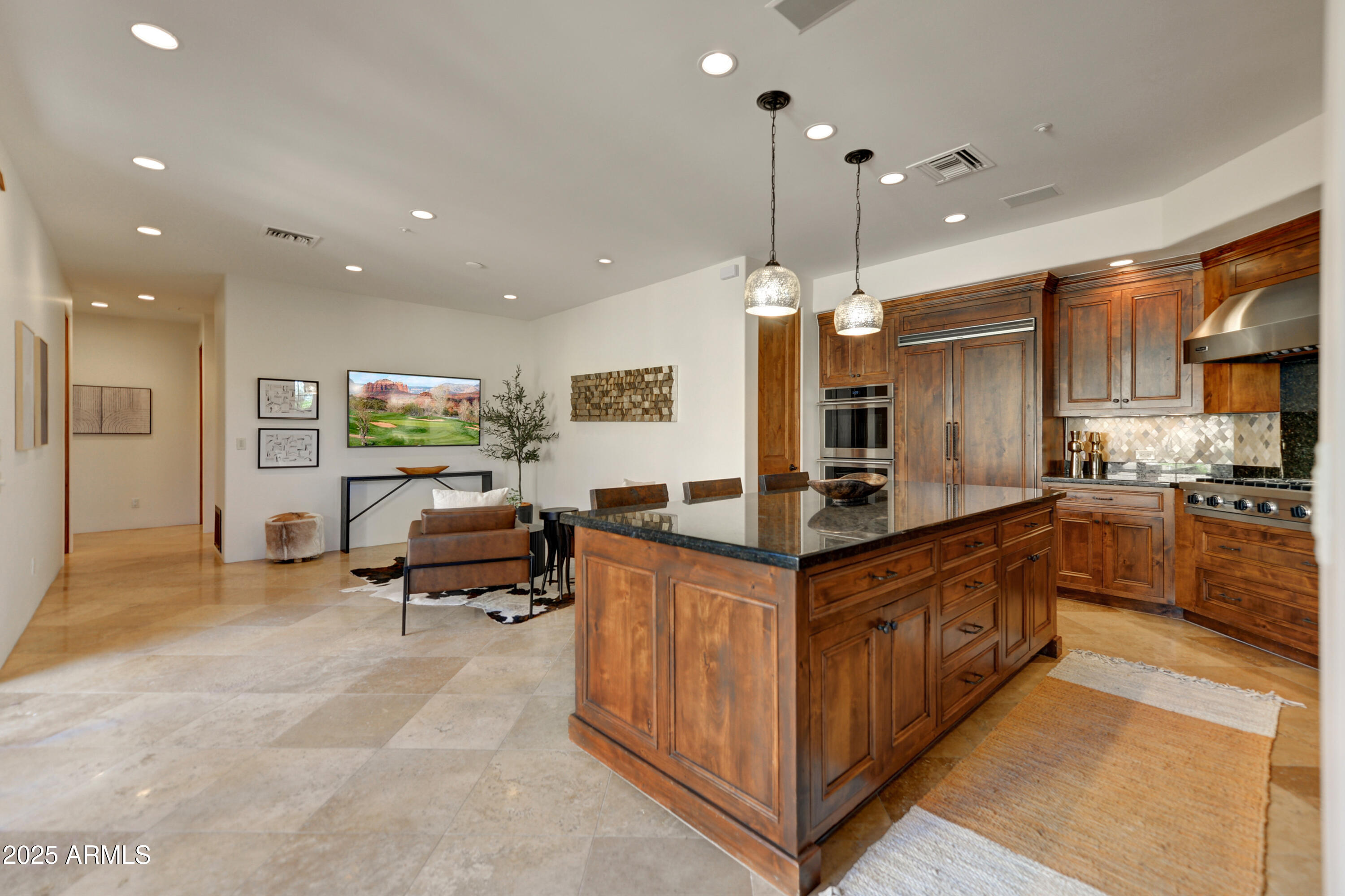 10575 East Rising Sun Drive Scottsdale, AZ 85262 - Photo 19 of 48 a kitchen with stainless steel appliances granite countertop a stove and a sink