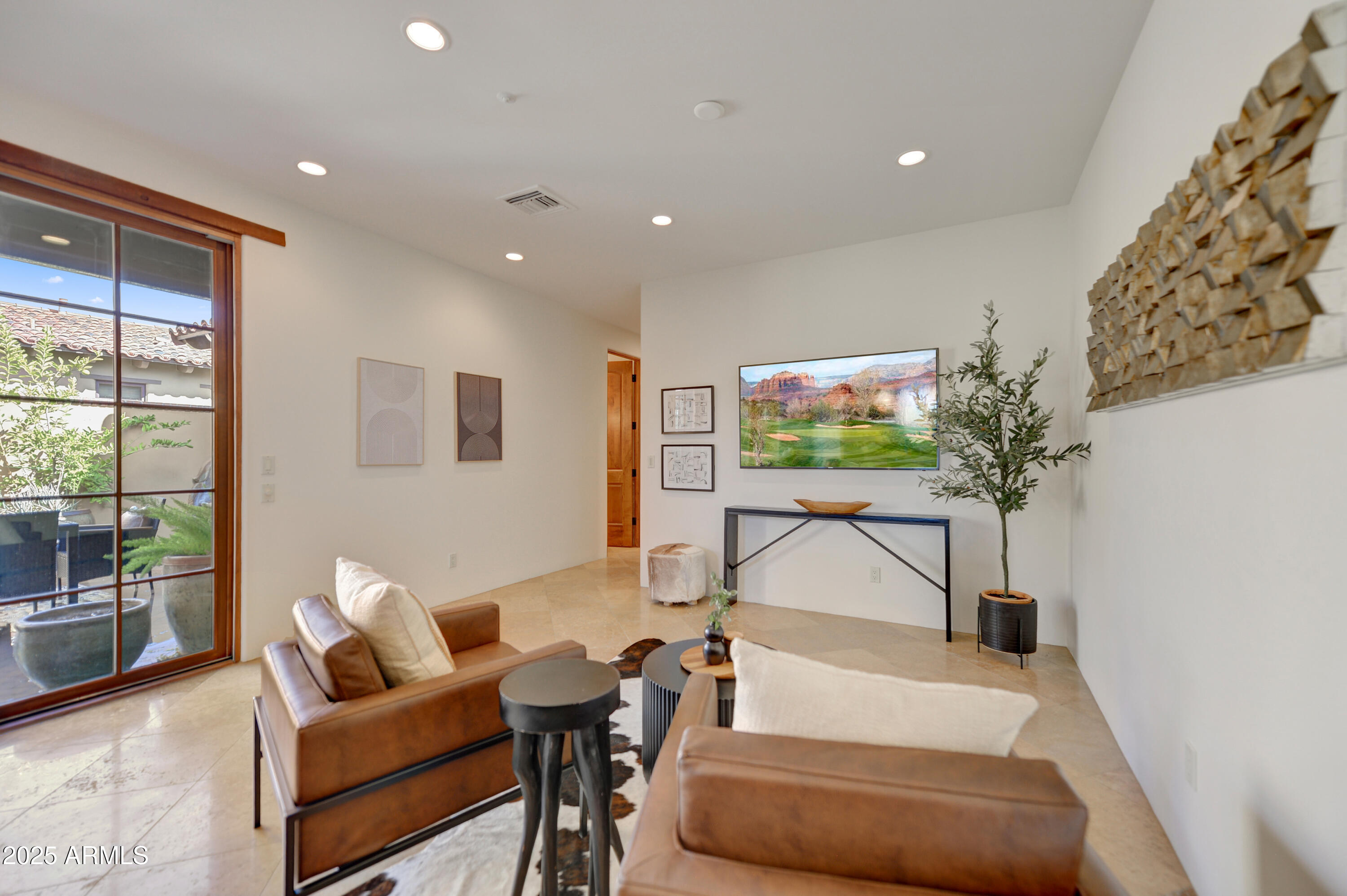 10575 East Rising Sun Drive Scottsdale, AZ 85262 - Photo 20 of 48 a living room with furniture and a flat screen tv