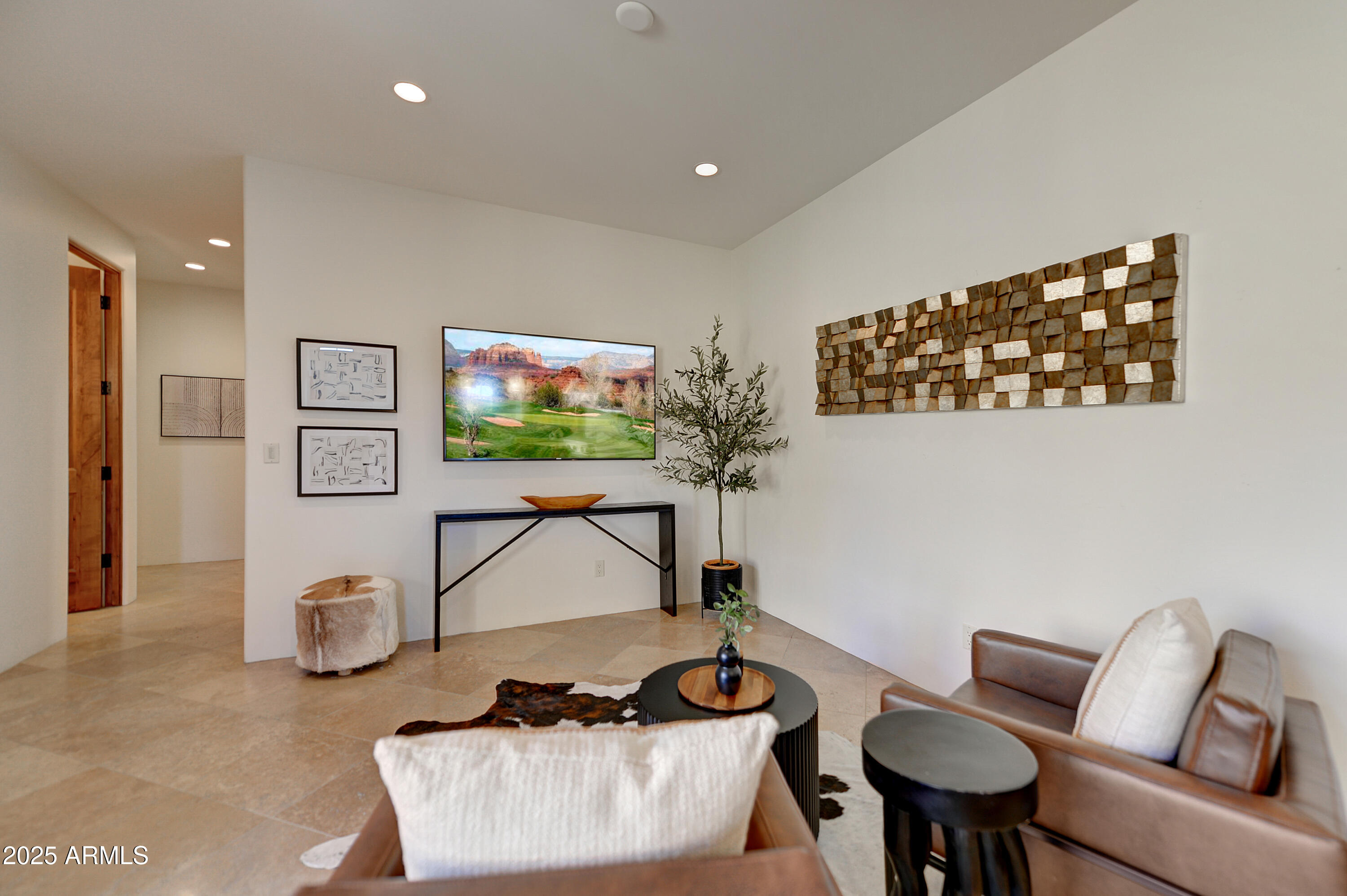 10575 East Rising Sun Drive Scottsdale, AZ 85262 - Photo 21 of 48 a living room with furniture and a flat screen tv