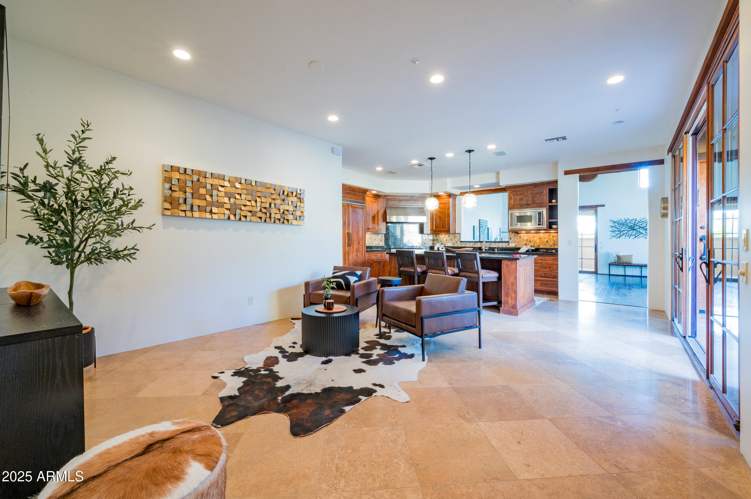 10575 East Rising Sun Drive Scottsdale, AZ 85262 - Photo 23 of 48 a living room with lots of furniture and a potted plant