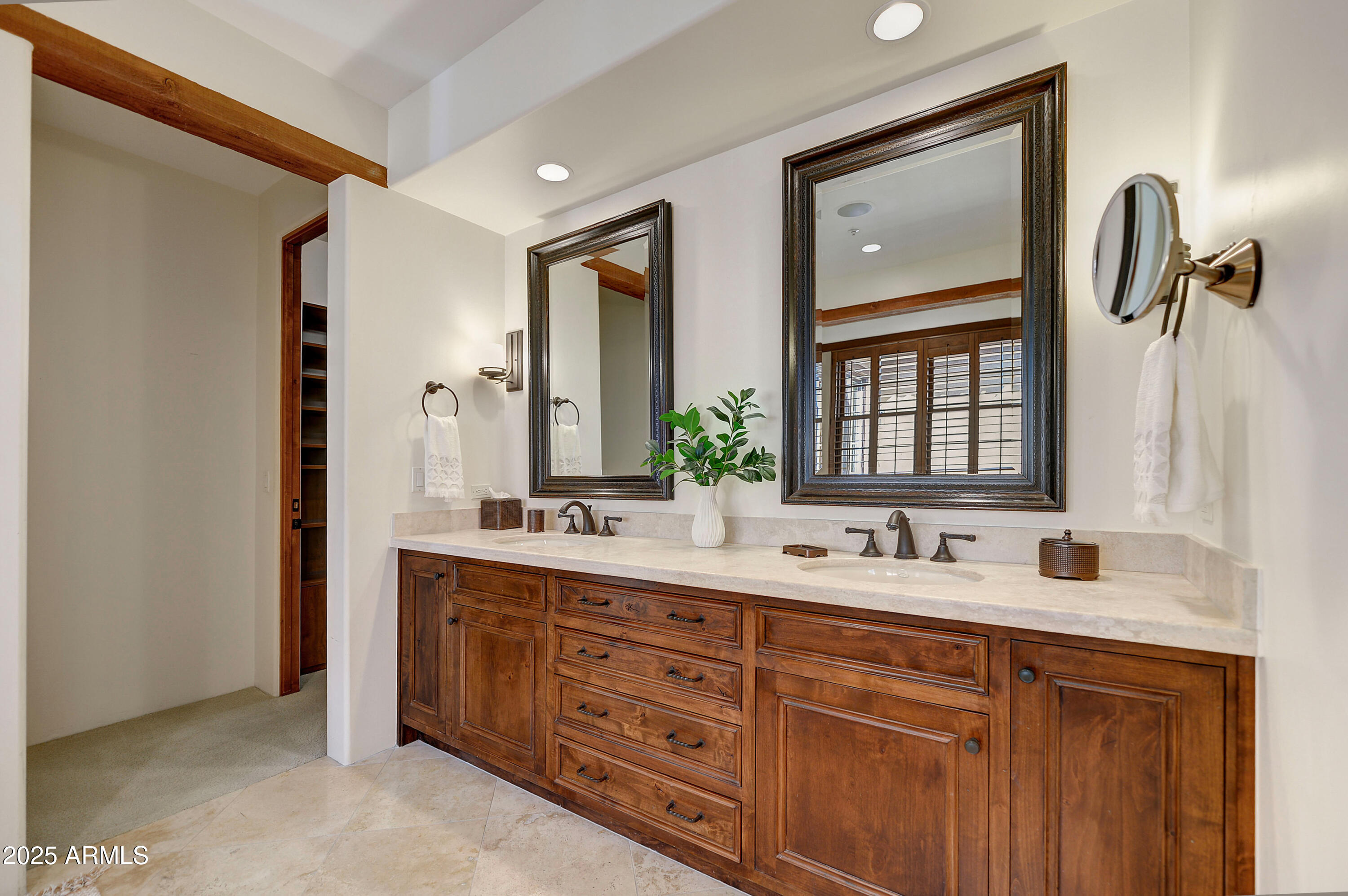 10575 East Rising Sun Drive Scottsdale, AZ 85262 - Photo 28 of 48 a bathroom with a double vanity sink and mirror