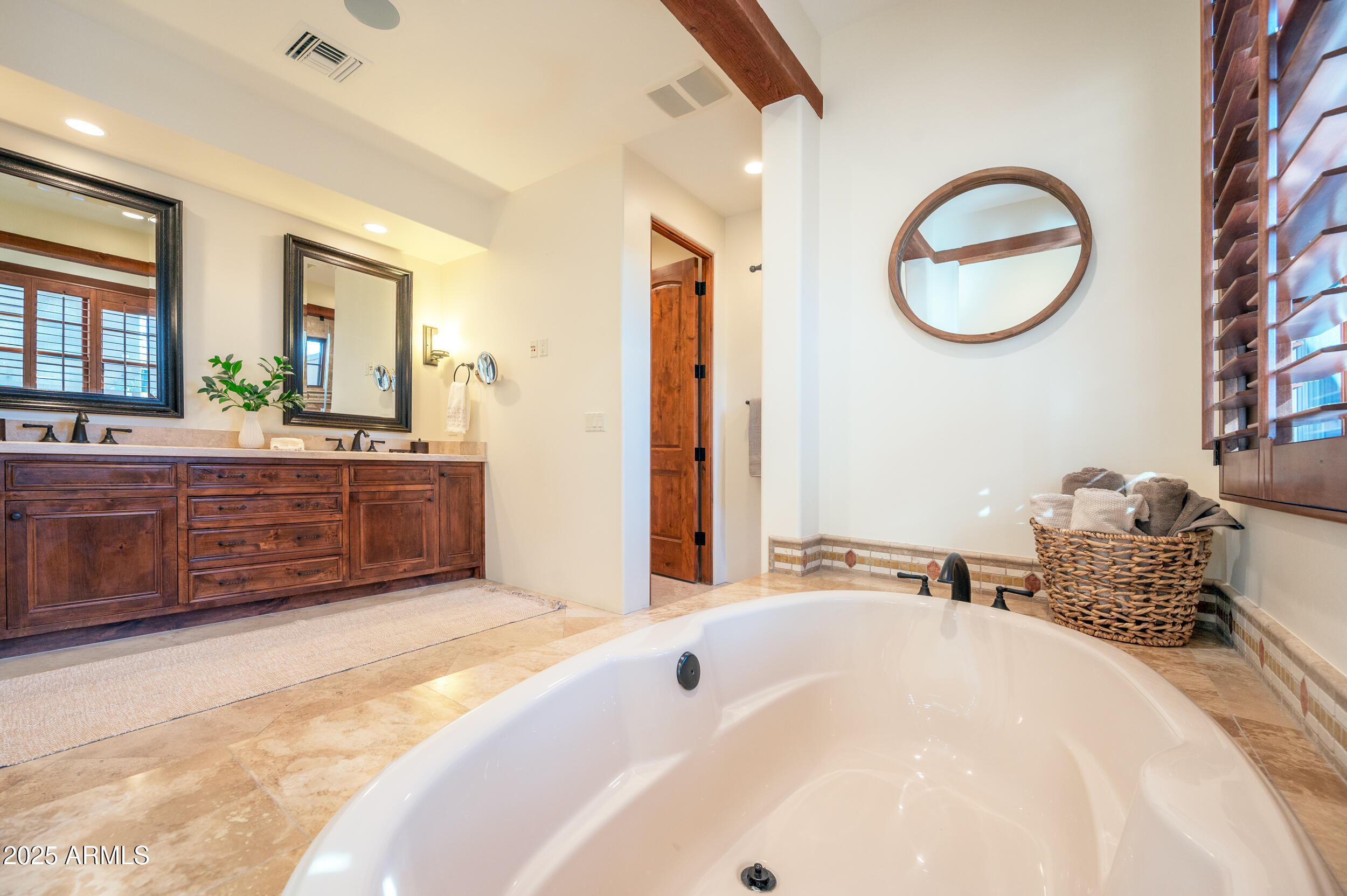 10575 East Rising Sun Drive Scottsdale, AZ 85262 - Photo 30 of 48 a spacious bathroom with a tub double vanity and a mirror