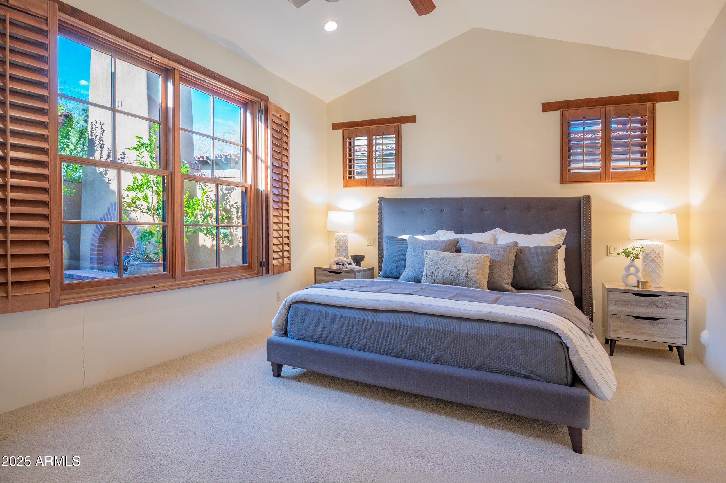 10575 East Rising Sun Drive Scottsdale, AZ 85262 - Photo 33 of 48 a spacious bedroom with a bed and a large window