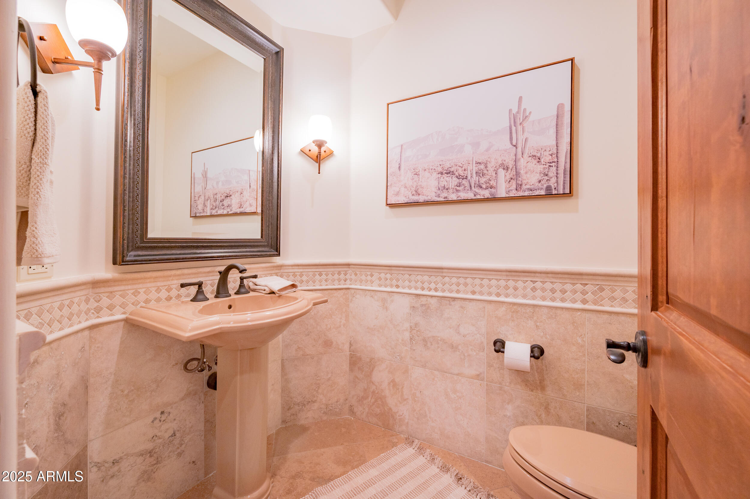 10575 East Rising Sun Drive Scottsdale, AZ 85262 - Photo 40 of 48 a bathroom with a sink mirror and a toilet
