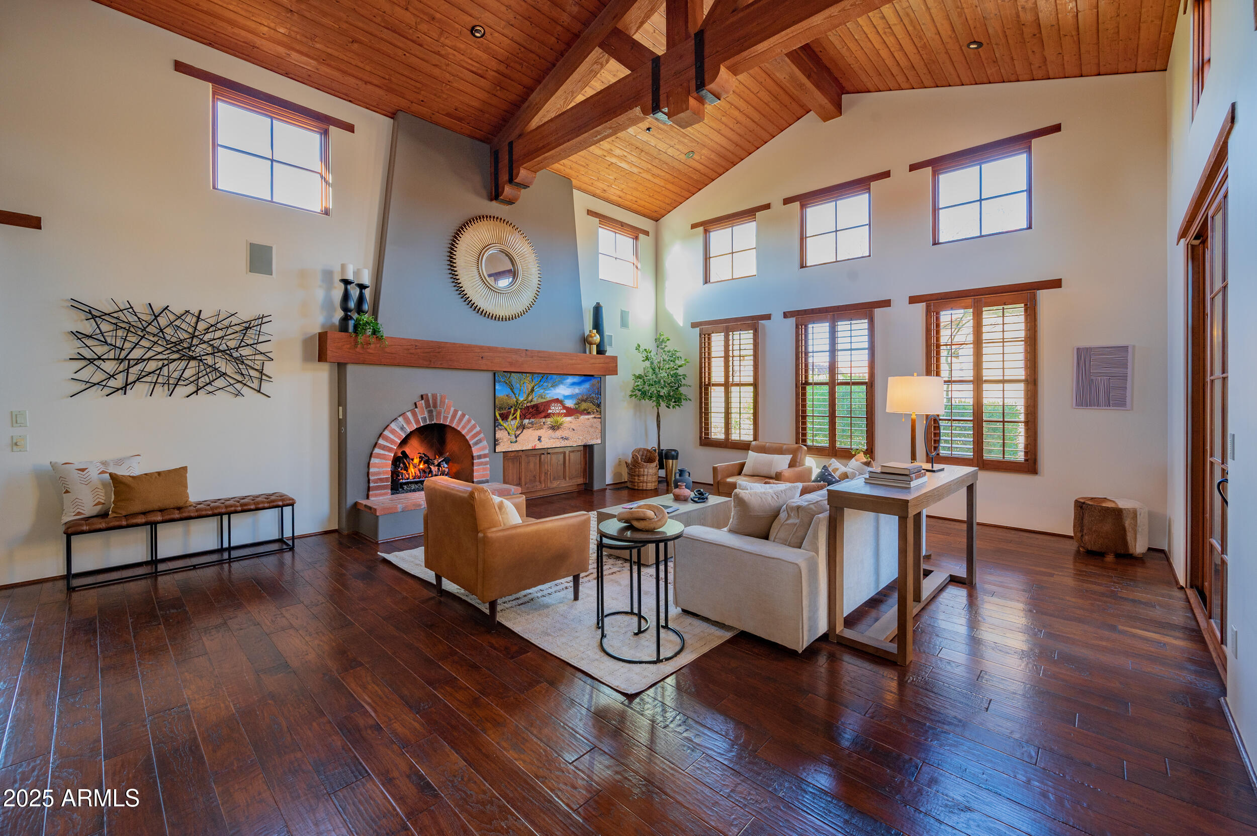 10575 East Rising Sun Drive Scottsdale, AZ 85262 - Photo 8 of 48 a living room with fireplace furniture and a wooden floor