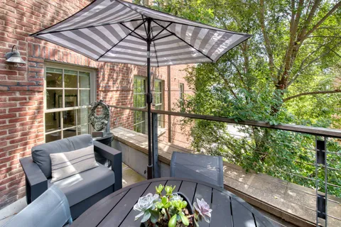 a patio with table and chairs