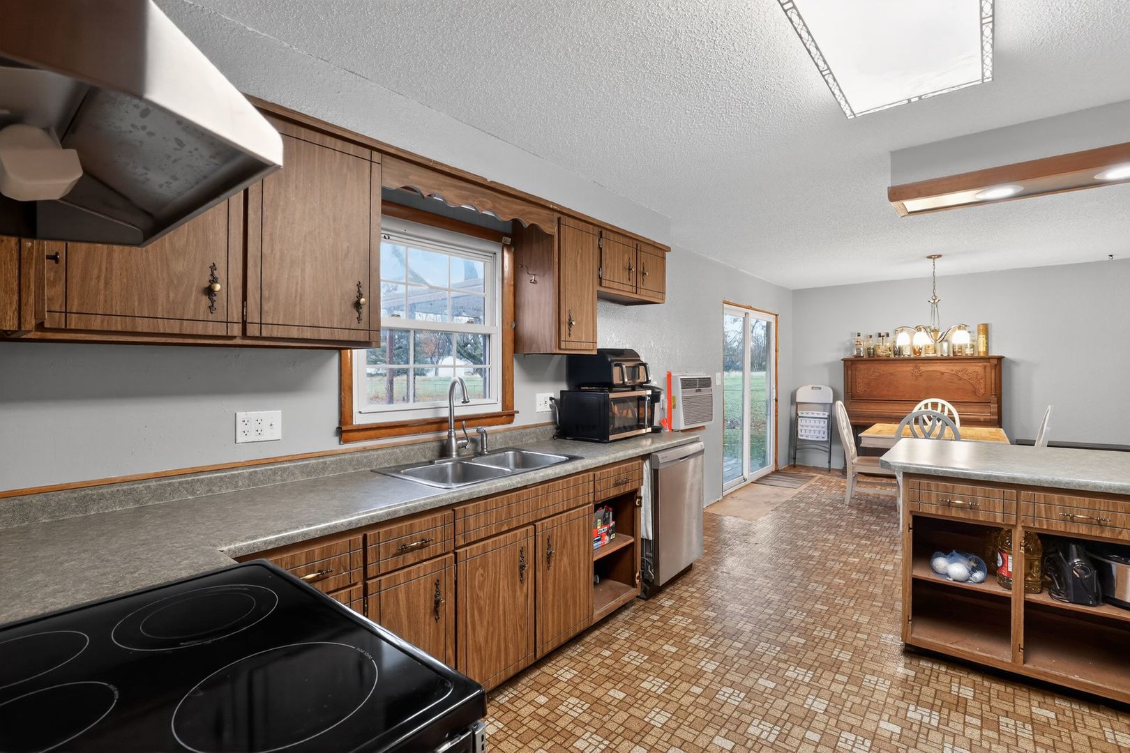 1531 North Charleston Road Salem, IL 62881 - Photo 13 of 34 a kitchen with stainless steel appliances granite countertop a stove and a sink