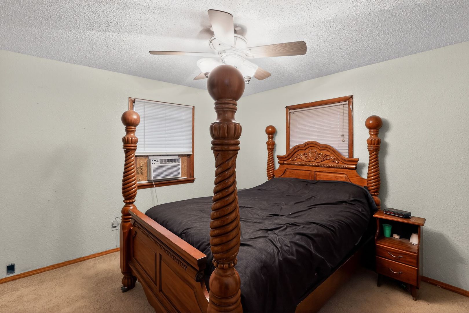 1531 North Charleston Road Salem, IL 62881 - Photo 18 of 34 a bedroom with a bed and a chandelier