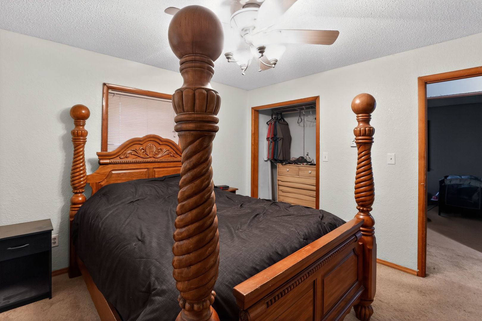 1531 North Charleston Road Salem, IL 62881 - Photo 20 of 34 a bedroom with a bed and a chandelier