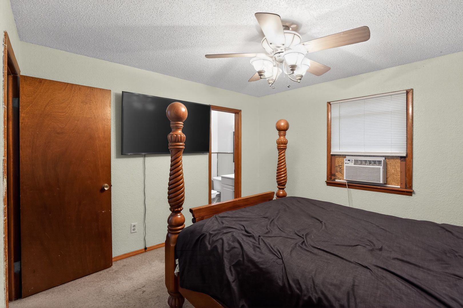 1531 North Charleston Road Salem, IL 62881 - Photo 21 of 34 a bedroom with a bed and a chandelier