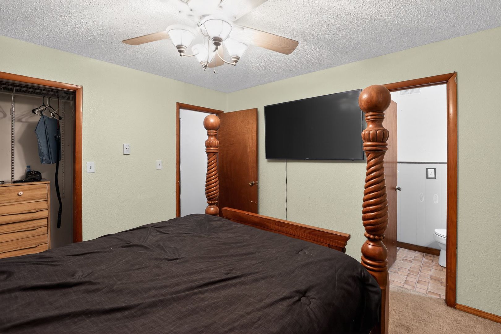 1531 North Charleston Road Salem, IL 62881 - Photo 23 of 34 a bedroom with a bed and a flat screen tv